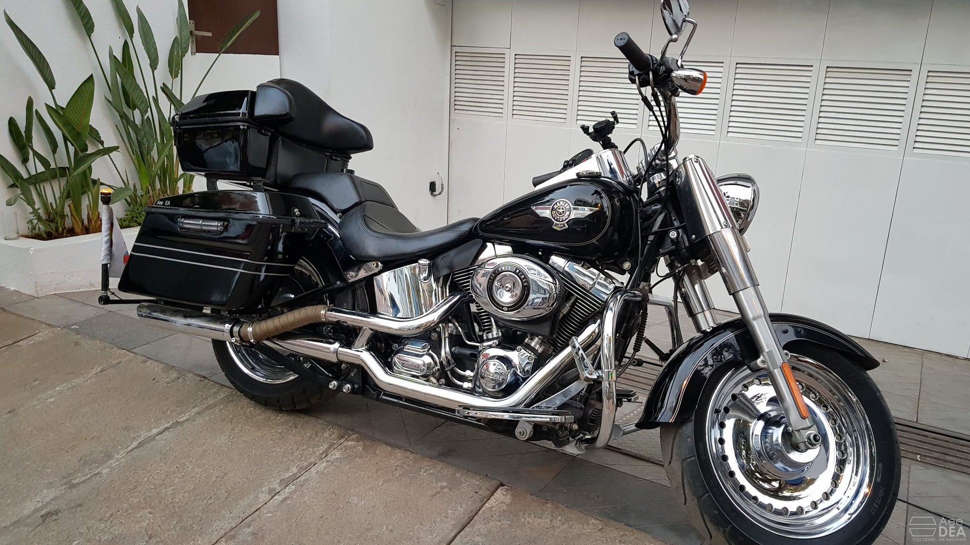 Custom side pannier system for Harley Fat Boy touring setup