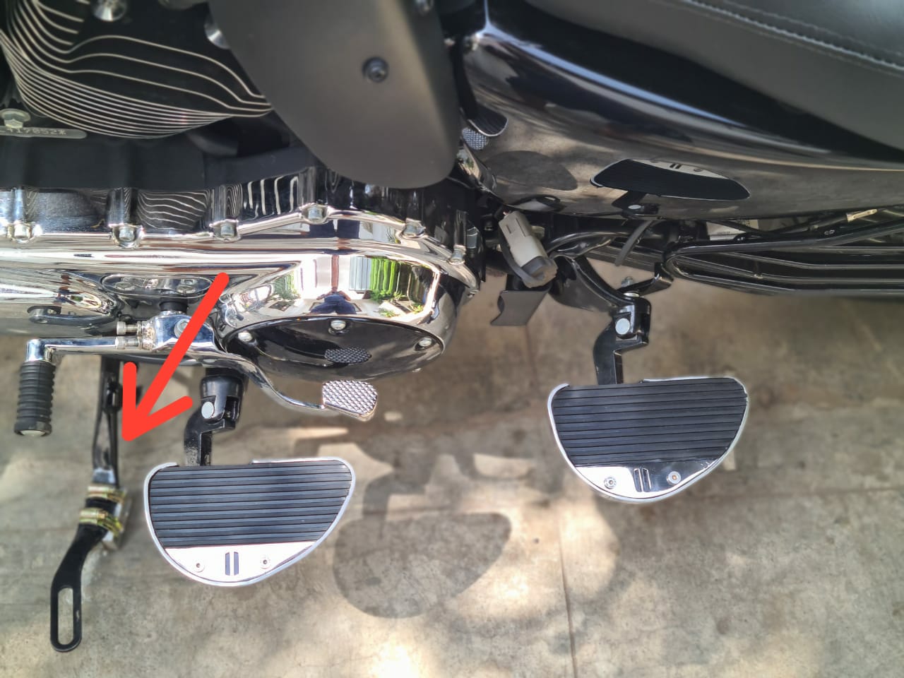 Motorcycle side stand extender installed for improved parking stability
